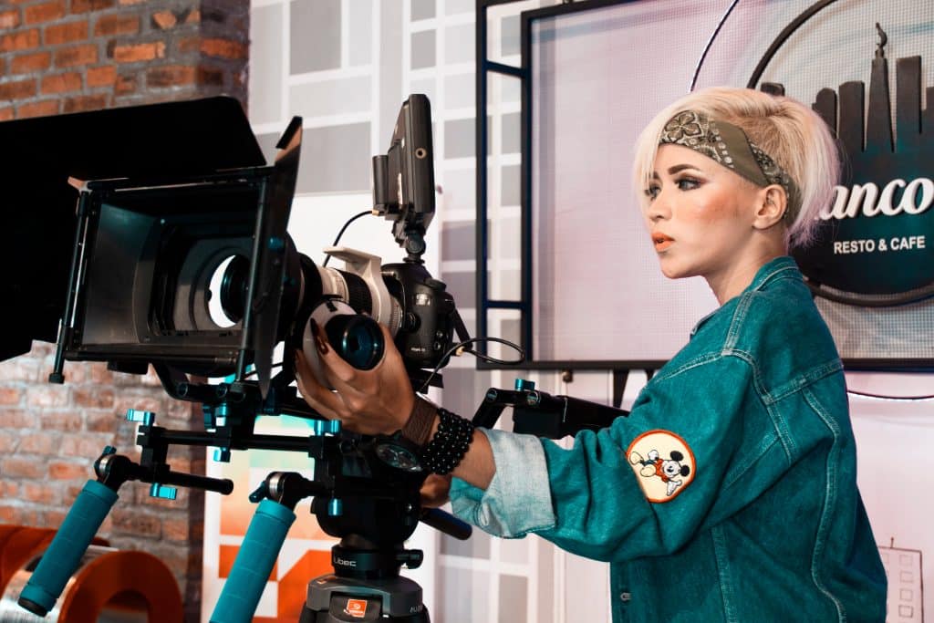Woman Operating Video Recorder